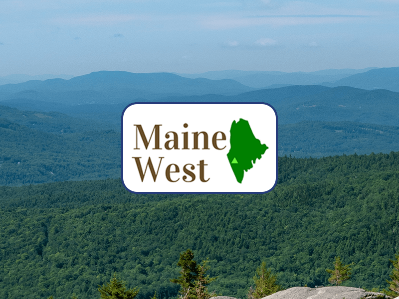 Maine west logo over an image of an evergreen mountain view.